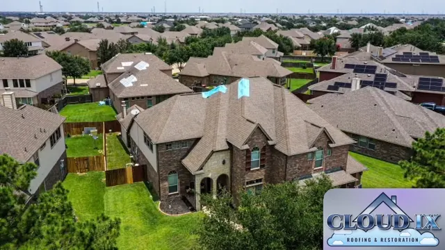 Emergency tarps on a storm-damaged two-story home in Spring, TX during a wind and hail insurance claim